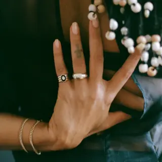 Handmade J.Hannah Stacked Signet Ring with black onyx and recycled diamond, crafted from 100% recycled 14k gold.