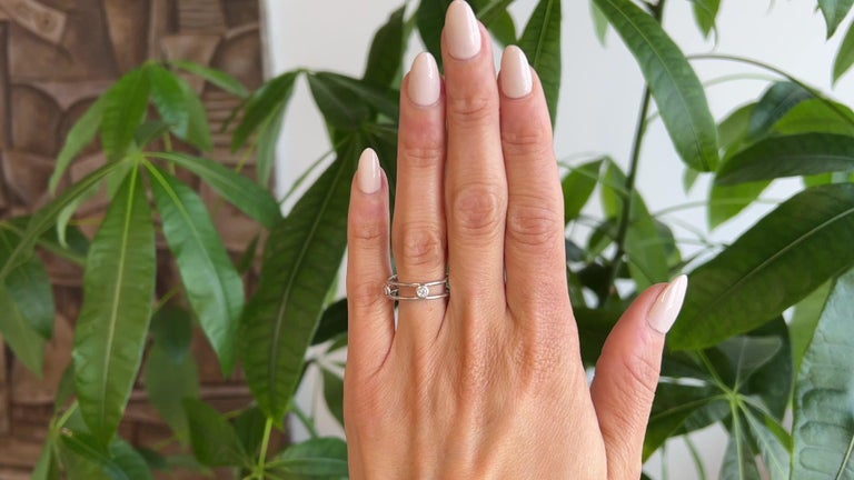 Minimalist 18K yellow gold band featuring five bezel-set diamonds by Elsa Peretti for Tiffany & Co