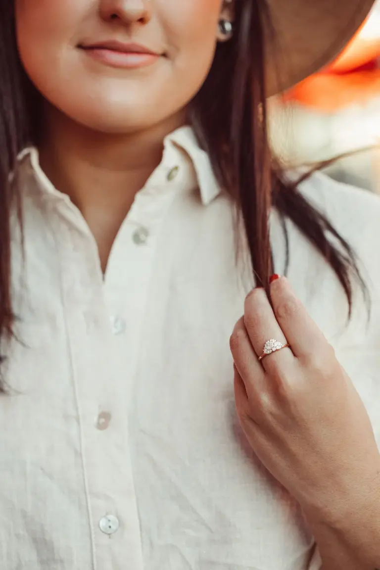 Model wearing The Luna Band diamond engagement ring with marquise and round stones, crafted in 14k rose gold with a distinctive fan-inspired silhouette