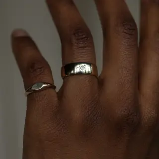 Ethically sourced Fairmined gold ring with reclaimed princess‑cut diamond, WWAKE Row Ring No. 4 in 14 k yellow gold, wide band design.