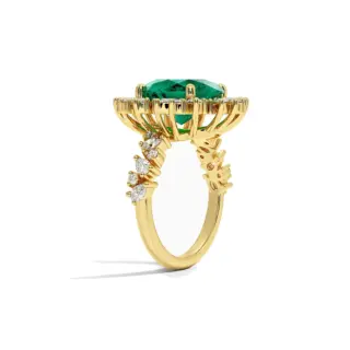 Close-up of Olivetta emerald ring with lab-created gemstones and floral diamond accents in gold band