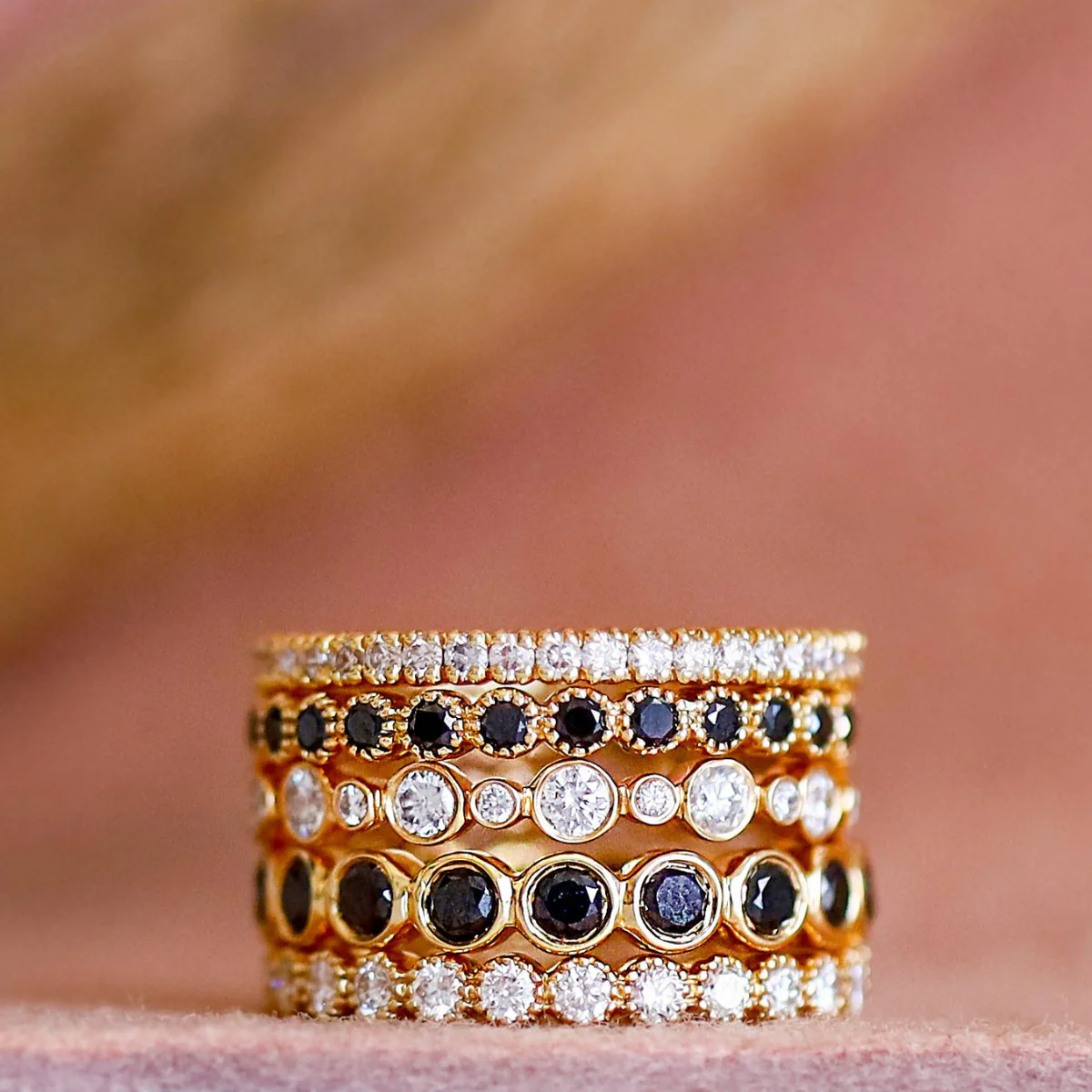 Close-up of Sethi Couture Bezel White Diamond Band showcasing 24 bezel-set diamonds in 18K yellow gold with milgrain finish, emphasizing its vintage-inspired design.