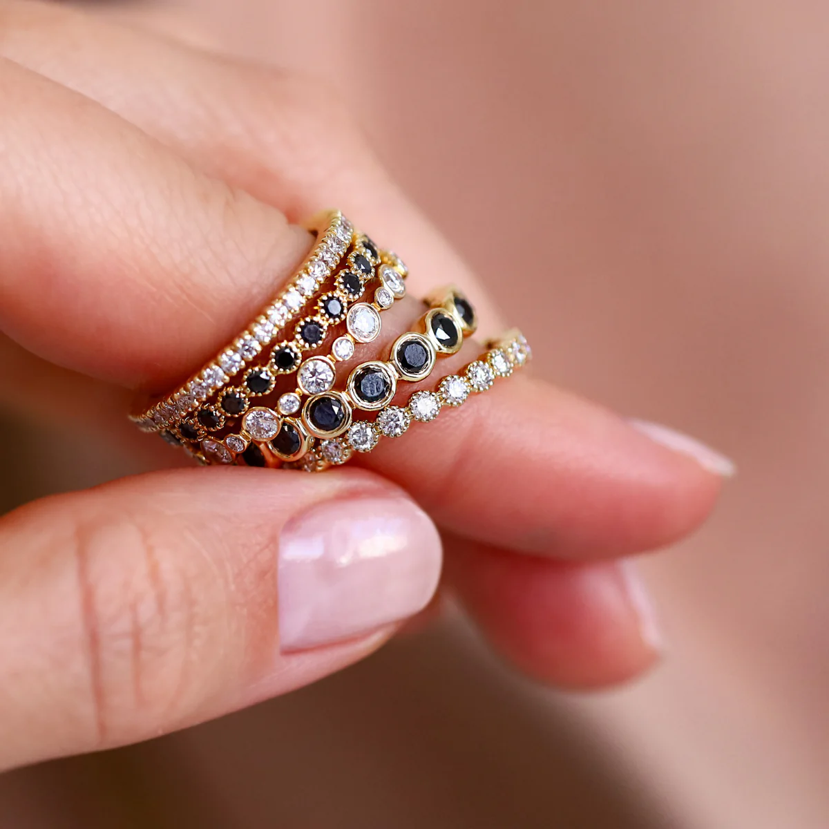 18K yellow gold eternity band with 24 bezel-set white diamonds and milgrain detailing.