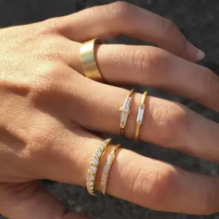 14K yellow gold Perryn ring featuring two tapered baguette diamonds (0.24 tcw) set in a polished band