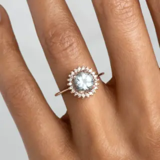 Ethically made aquamarine and diamond halo ring – modern celestial-inspired design in solid gold