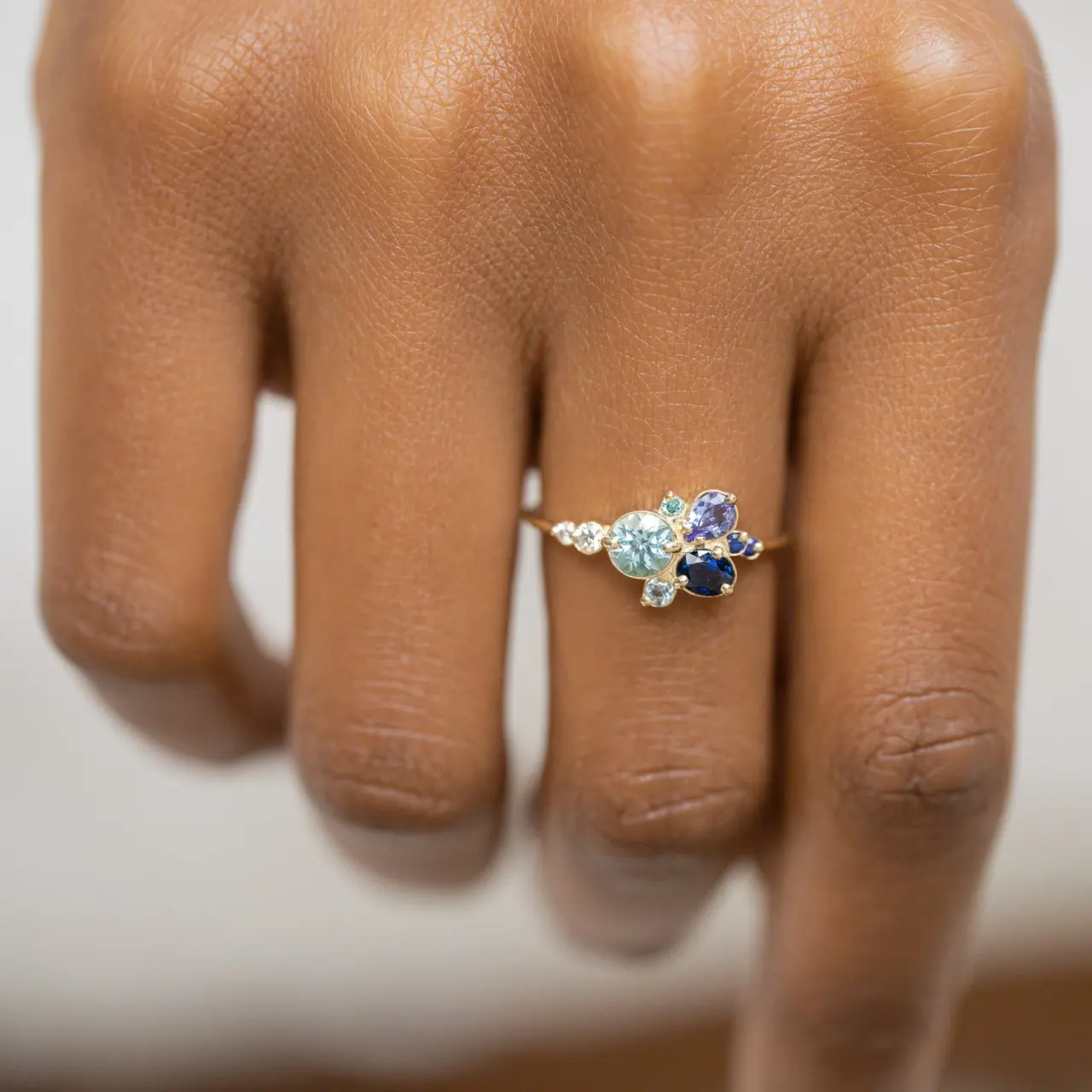 Elegant 14k gold ring featuring pale blue aquamarine flanked by white diamonds – ethereal fine jewelry