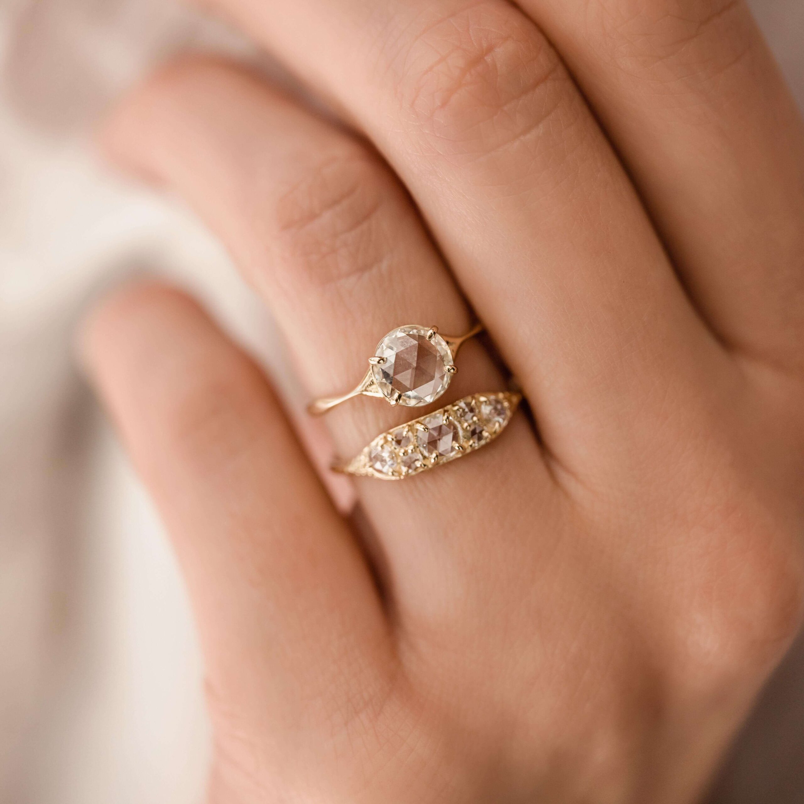 Melanie Casey's Overture Ring: A 14k gold band with seven rose cut diamonds, offering a unique, antique-inspired design