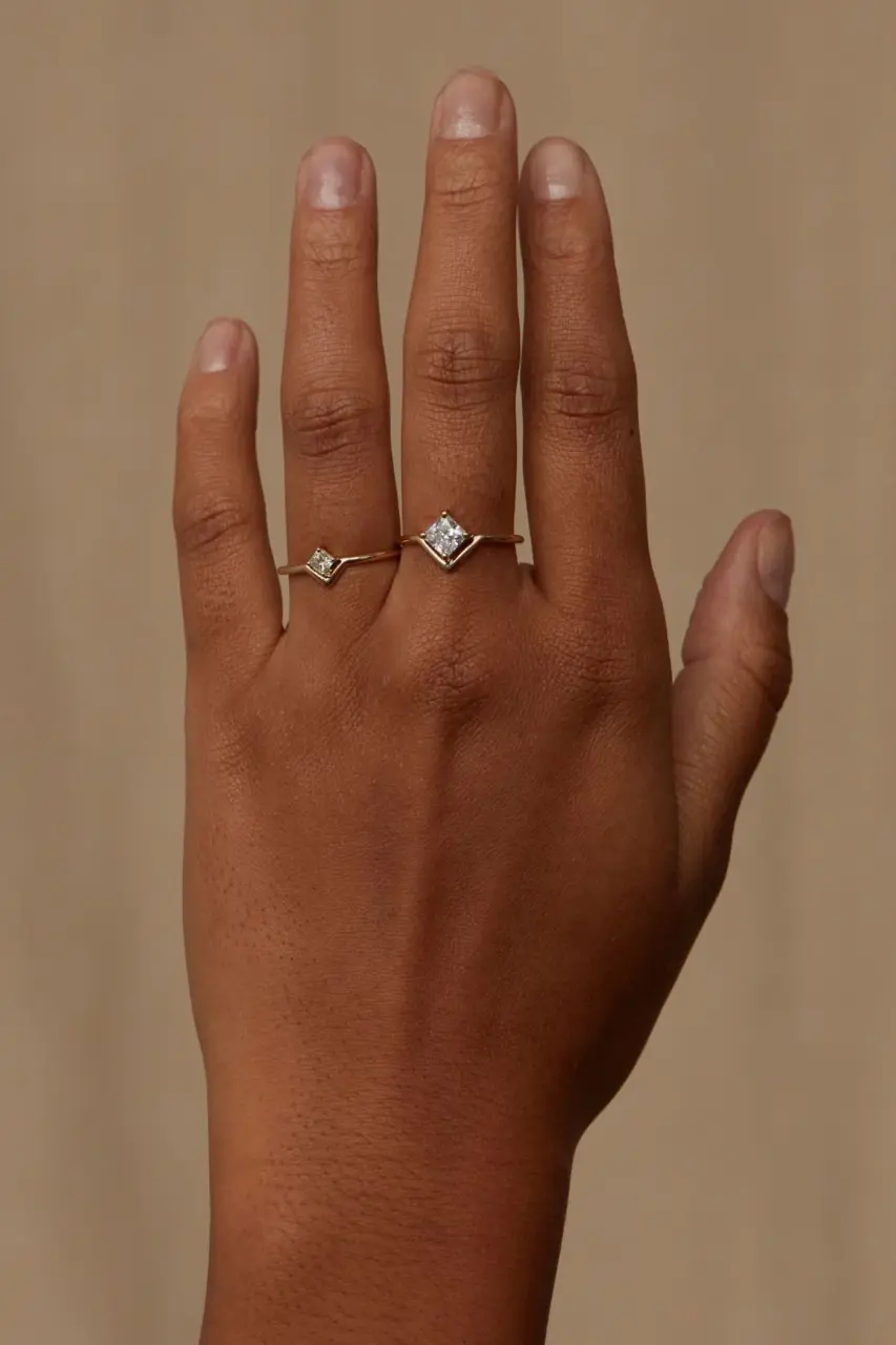 Minimalist 14k gold ring featuring a princess cut diamond set in a unique nestled design by Wwake
