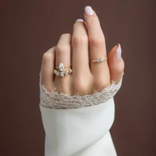 Whimsical diamond garland ring with alternating marquise and round stones in solid gold band