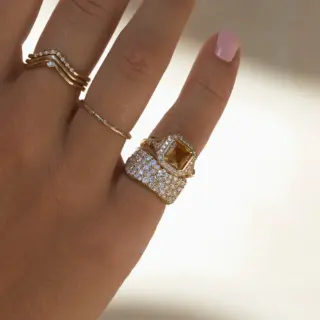 The Bobbie Ring featuring a horizontally set marquise diamond on slim 14k gold band
