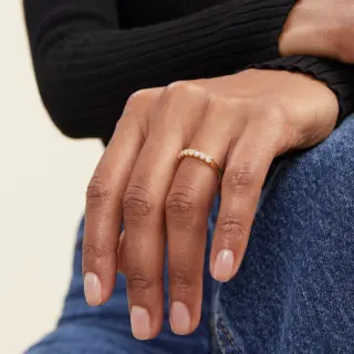 Elegant 14k yellow gold half eternity band by Mejuri, adorned with seven round brilliant diamonds, ideal for stacking.