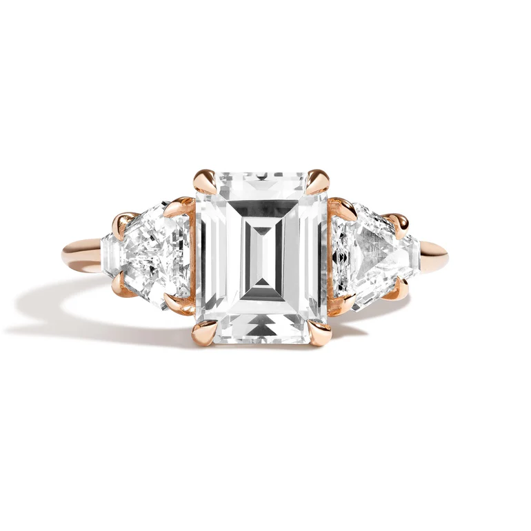 3‑Stone Emerald‑Cut and Cut‑Corner Triangle Ring on hand, highlighting modern symmetry and diamond design