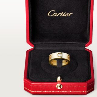 Cartier Love Ring Classic Model in 18k yellow gold, featuring three brilliant‑cut diamonds set into signature screw motifs on a 5.5 mm band