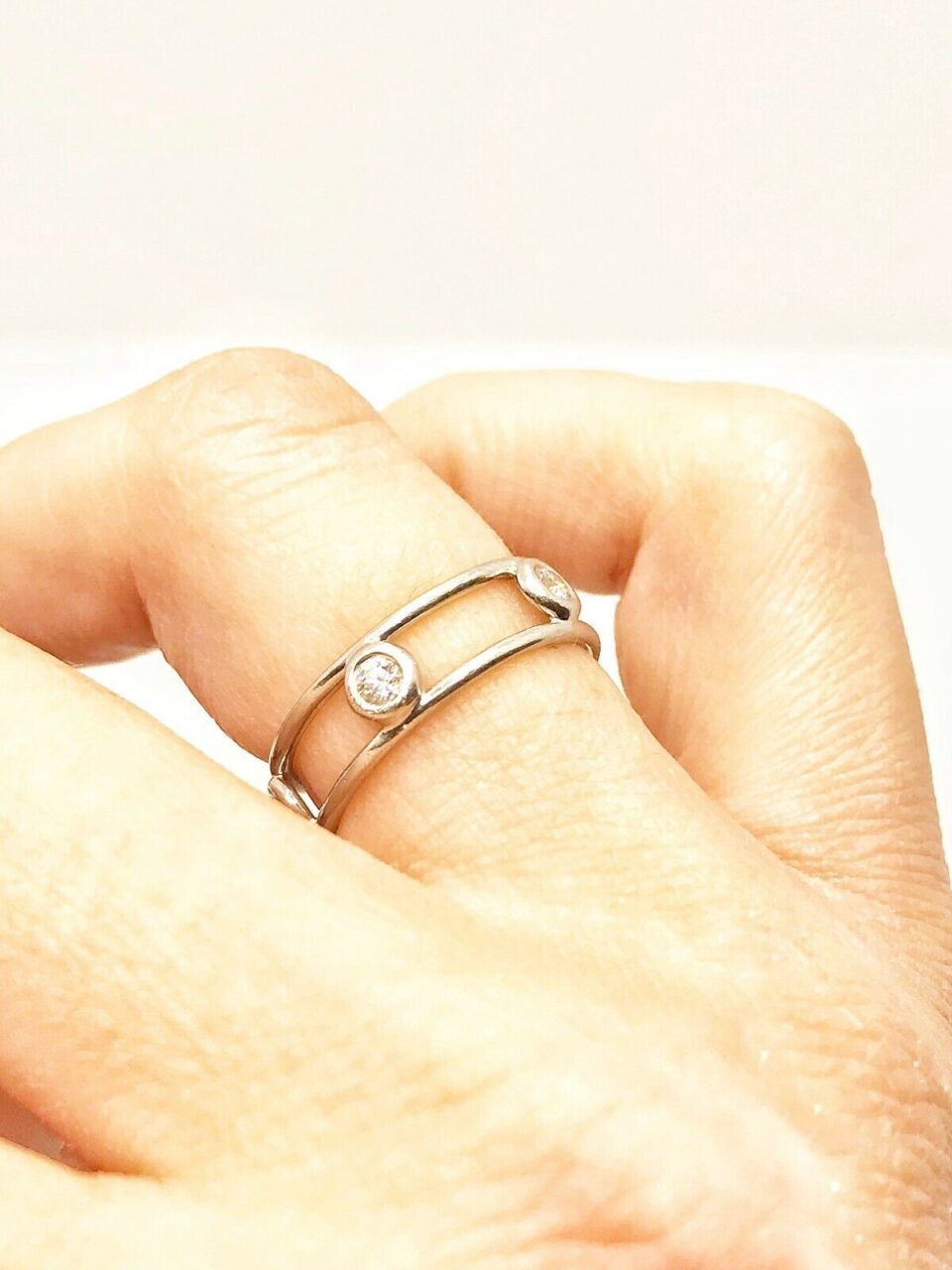 Tiffany & Co. Elsa Peretti® Diamonds by the Yard® Ring showcasing five round brilliant diamonds in a polished gold band.