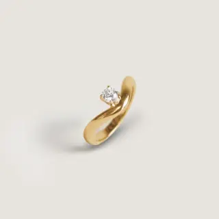 Elegant gold curved diamond ring for women by Kinn Studio, sustainable fine jewelry with lab-grown diamond