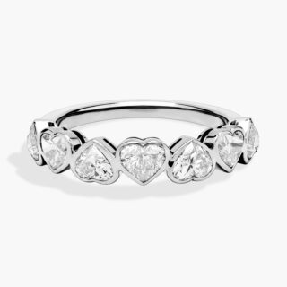 Heart-shaped diamond engagement ring set in white gold, featuring a delicate band that highlights the romantic and elegant center stone.