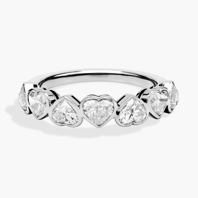 Heart-shaped diamond engagement ring set in white gold, featuring a delicate band that highlights the romantic and elegant center stone.