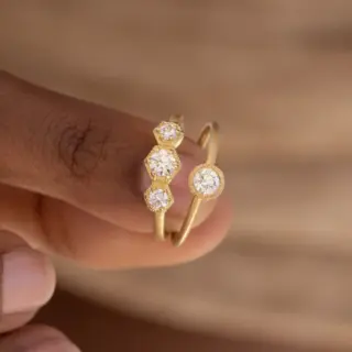 Side profile of Audry Rose's 18k Brushed Bezel Diamond Solitaire Ring highlighting the 1.5mm matte yellow gold band