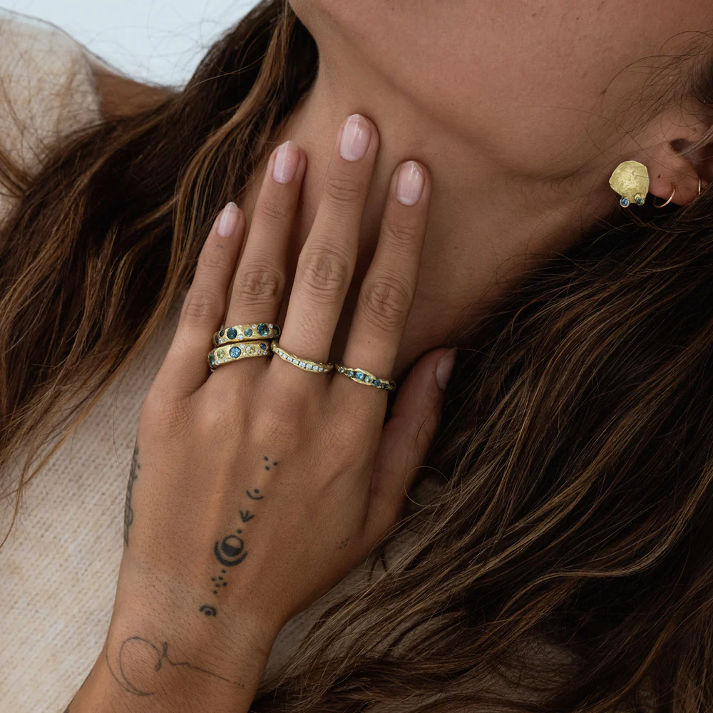 Contemporary gold band with step-set baguette diamonds – minimalist Crested Half Channel Ring