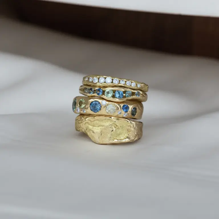 Elegant half-channel gold ring featuring graduating baguette diamonds – modern design by Audry Rose