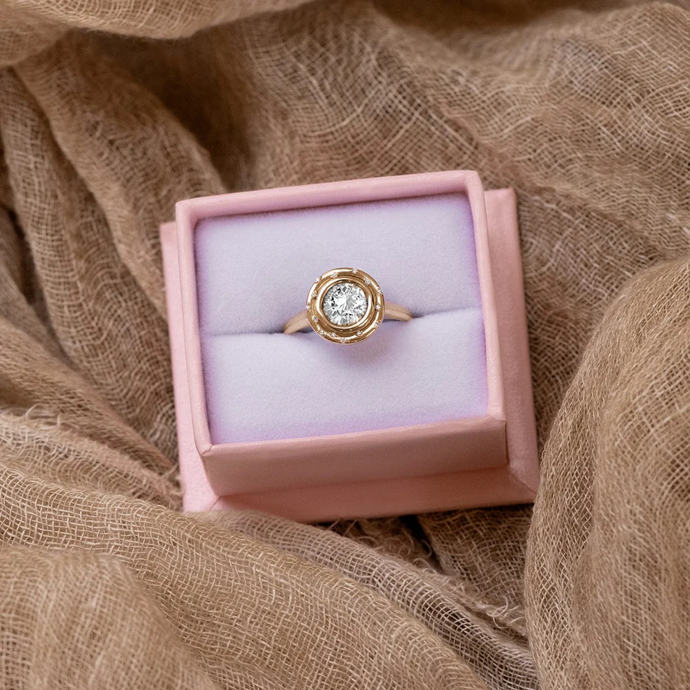 Close-up of Audry Rose Spotlight Ring showcasing 18K gold band and sparkling round diamonds.