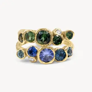 18K yellow gold Ocean Sapphires Seaweed Ring featuring organic seaweed-inspired ribbons encircling blue and green sapphires, each with a unique sea-worn finish.