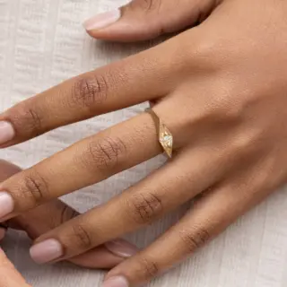 Audry Rose Eye of Ailuros Ring: A 14k yellow gold band adorned with three tapered white diamonds and hand-engraved whisker details, embodying feline elegance