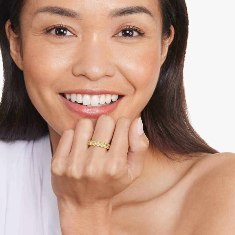 Timeless yellow gold eternity engagement ring with sparkling diamonds encircling the entire band, symbolizing eternal love and commitment.