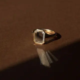 Close-up of the Maren Portrait Bezel Emerald Ring showcasing a 2.50 ct portrait-cut emerald set in a solid 14k gold bezel.