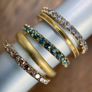 Full eternity band with green sapphires in 14k recycled gold by Elliot Gaskin, handcrafted in NYC