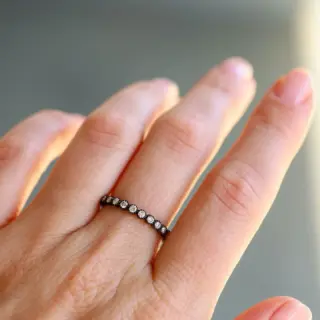 Sethi Couture 18K yellow gold Bezel White Diamond Band with 24 brilliant-cut diamonds totaling 0.70ct, featuring milgrain finish, ideal for stacking or as a standalone ring