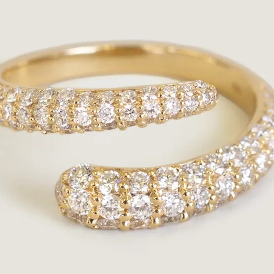 Close-up of the Pavé Wrap Around Ring showcasing round rogue diamonds set in solid gold