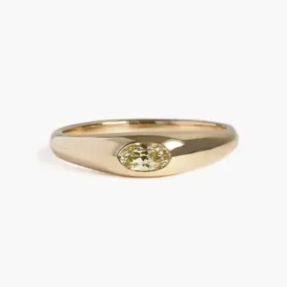 Side view of the Yellow Sapphire Petite Risa Ring highlighting the 4.4mm to 2mm tapered band and solid 14k recycled gold construction