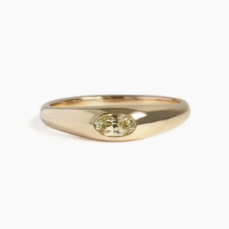 Side view of the Yellow Sapphire Petite Risa Ring highlighting the 4.4mm to 2mm tapered band and solid 14k recycled gold construction