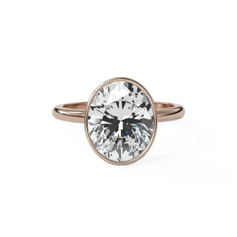 Penumbra Bezel Engagement Ring by GoodStone: 18k white gold band featuring a 4.51ct lab-grown oval cut diamond, offering a modern and secure setting