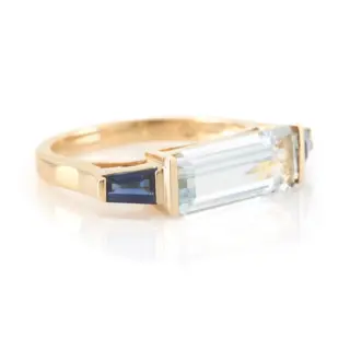 Side profile of Aquamarine with Sapphire triplet ring, featuring intricate band detailing and a raised setting that enhances the brilliance of the gemstones.