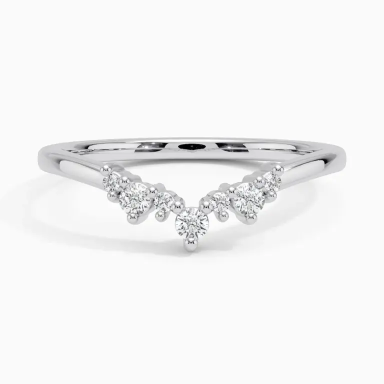 Aubrey diamond ring in 18 K white gold, featuring a delicate curved band with seven round prong-set accent diamonds (0.11 ct total) in F/G color, SI1 clarity.