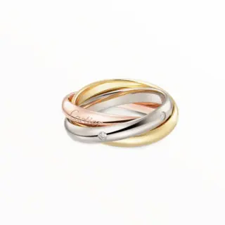 Cartier Trinity ring classic model with three intertwined bands in white, yellow, and rose gold, set with five brilliant-cut diamonds.