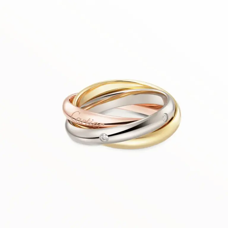 Cartier Trinity ring classic model with three intertwined bands in white, yellow, and rose gold, set with five brilliant-cut diamonds.