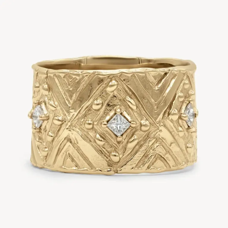 Close-up of the Grecian Diamond Cigar Band showcasing six 2mm princess-cut white diamonds set in a 14k yellow gold band.