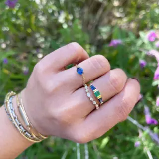 Side profile of the Diamond Crown Ring highlighting its smooth band and diamond arrangement.