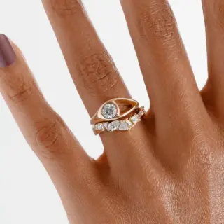 Bario Neal Aira Ring with 0.50 ct diamond burnish-set next to sculptural open-space void.