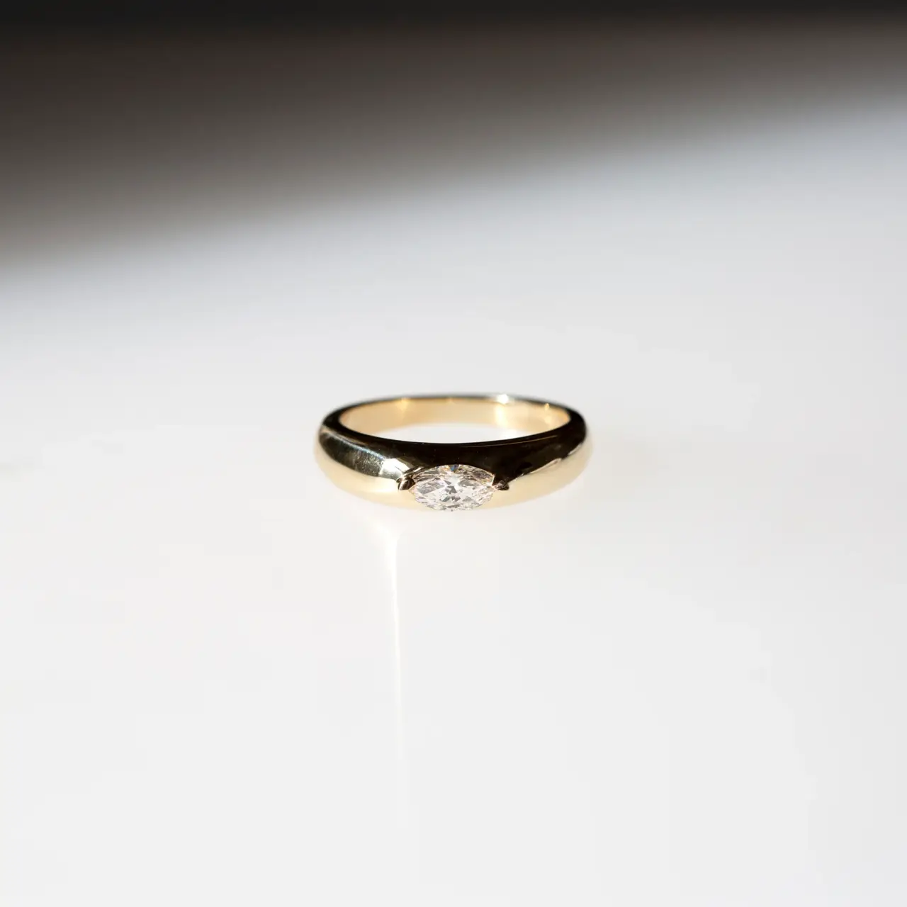 apered 5 mm wide gold Demi Demi ring with marquise diamond centerpiece