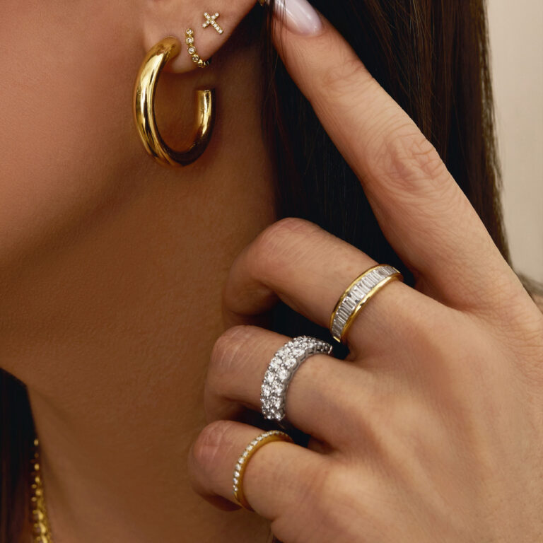 Elegant engagement ring featuring graduated baguette diamonds in a channel setting on a 14k gold band.