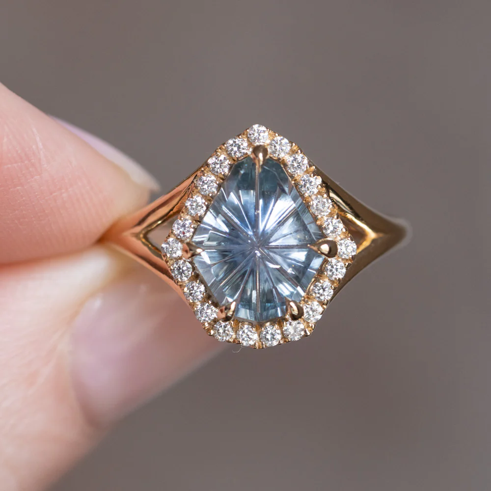 Side view of the 2.34ct fantasy cut carved shield Montana sapphire ring by Anueva Jewelry, highlighting the low-profile setting and split shank band.