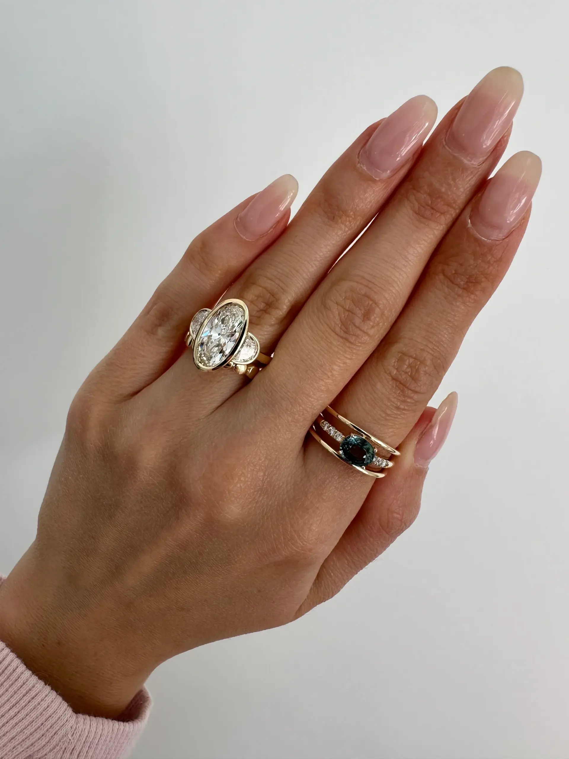 Side view of Orianne three‑stone ring featuring low‑set oval and half‑moon lab diamonds in 14K yellow gold.