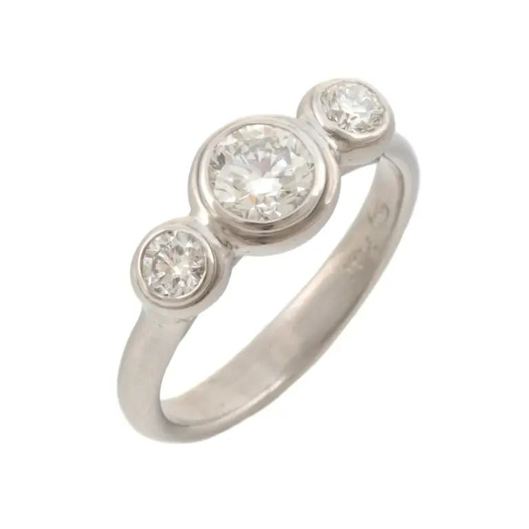 Platinum Lunette-style three-stone engagement ring featuring a 0.64ct round brilliant center diamond (SI2 clarity, H color) and two 0.15ct side diamonds (VS2 clarity, F-G color), totaling 0.94ct in diamond weight