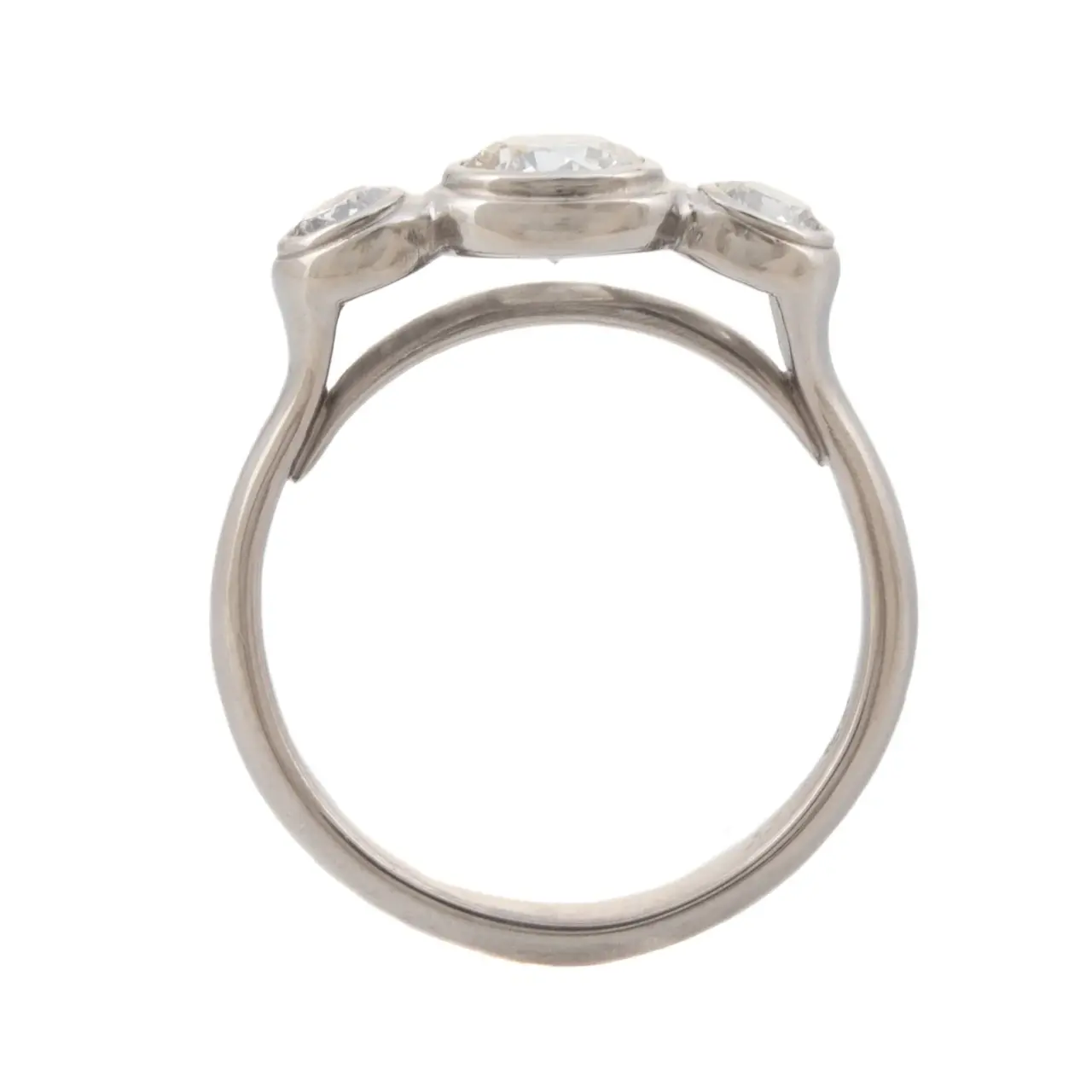Side view of the Three Stone Diamond Engagement Ring by Caleb Meyer, highlighting the 2.5mm band width and the Lunette-style setting.