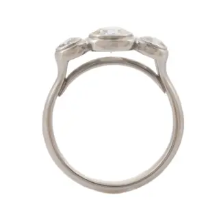 Side view of the Three Stone Diamond Engagement Ring by Caleb Meyer, highlighting the 2.5mm band width and the Lunette-style setting.