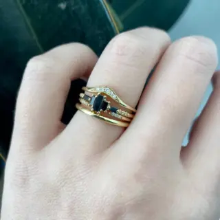 Jennie Kwon's Marcato Black Diamond Ring: A 14k gold piece featuring layered black and white diamonds, perfect for the modern, alternative bride